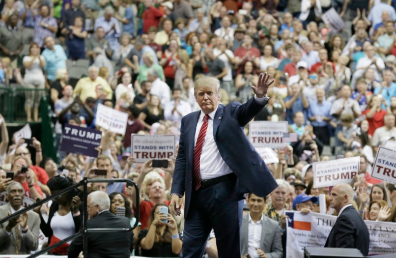 Republican presidential candidate Donald Trump waves to supporters after speaking at a campaign event in Dallas, Monday, Sept. 14, 2015. (AP Photo/LM Otero)