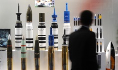 A man looks at tank ammunition at the Defence and Security Equipment International (DSEI) arms fair at the ExCeL centre in east London, on September 10, 2013. The arms fair describes it self as the world's largest fully integrated defence and security exhibition. AFP PHOTO / BEN STANSALL (Photo credit should read BEN STANSALL/AFP/Getty Images)